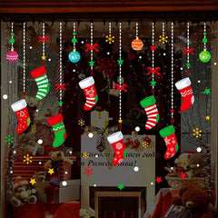 Decorative Christmas window with stockings, ornaments, and a fireplace.