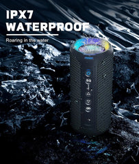 Waterproof portable speaker with IPX7 rating on a rocky surface with water.