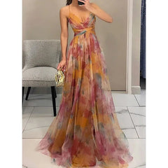 Woman wearing a colorful floral dress in an indoor setting