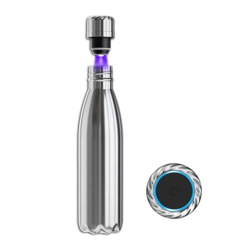 Clear water bottle with silver cap and black base on a white background