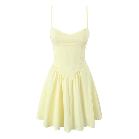 Yellow dress with thin straps on a white background