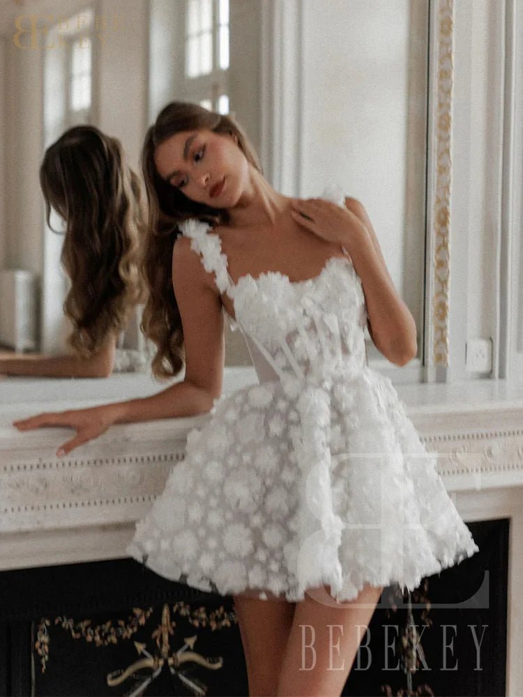Woman wearing a white floral dress in an elegant interior setting