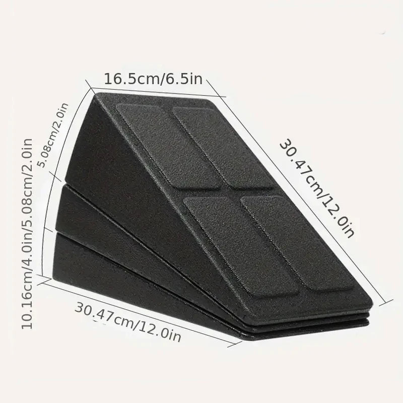 Black wedge-shaped door stopper with measurements on a white background