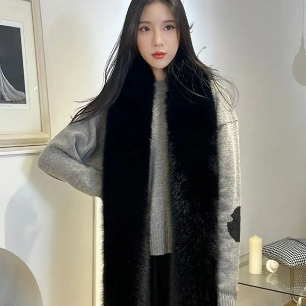 Woman wearing a black fur scarf in an indoor setting