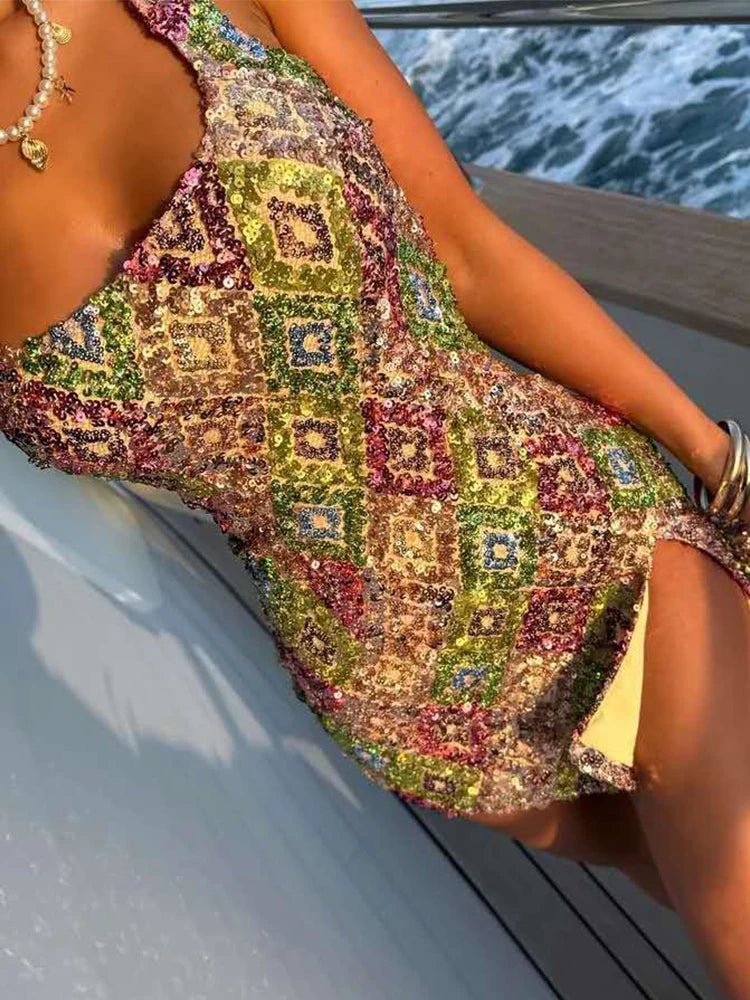 Person wearing a colorful patterned dress on a boat with water in the background