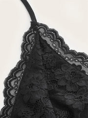 Close-up of black lace fabric on a white background