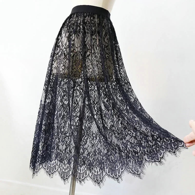 Black lace skirt on a mannequin against a white background
