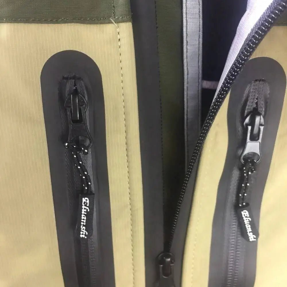 Close-up of a beige jacket with black zippers and 'Elamsh' branding.