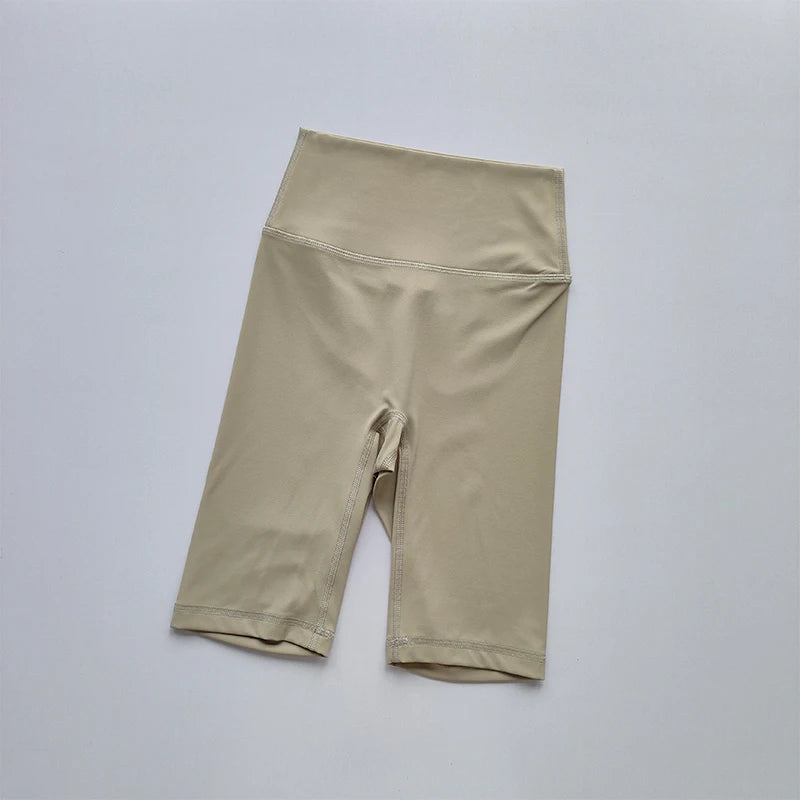 Beige shorts on a light gray background