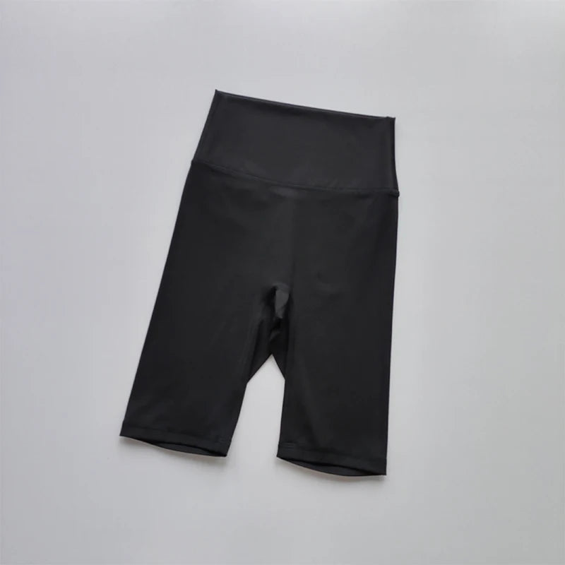 Black athletic shorts on a light gray background