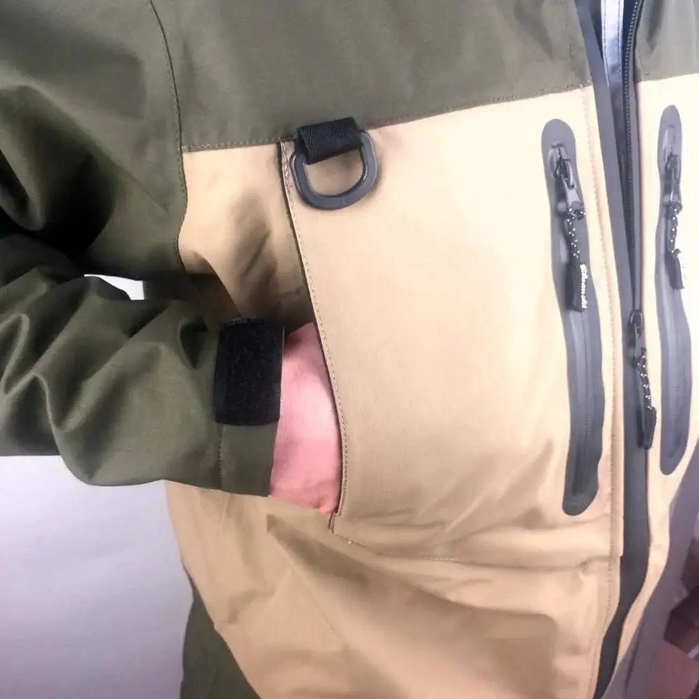 Close-up of a green and beige jacket with a pocket open, revealing pink fabric.