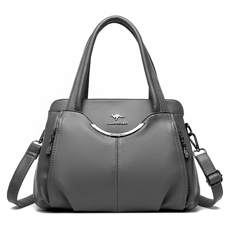 Gray handbag with a visible brand logo on a white background