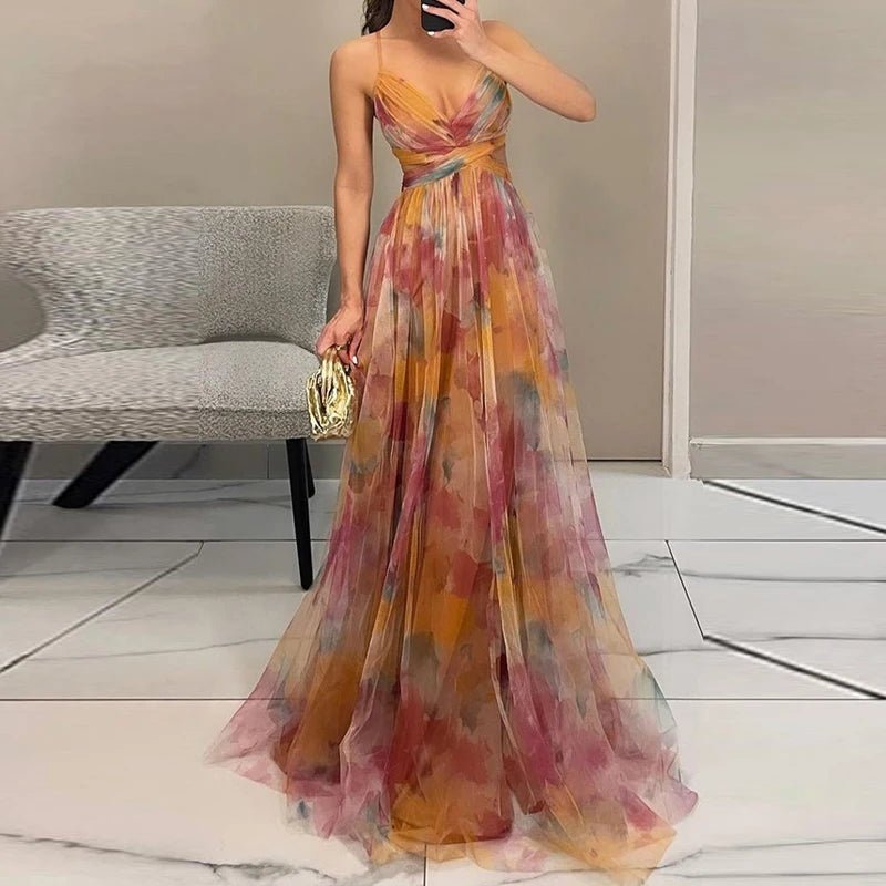 Woman wearing a colorful floral dress in an indoor setting.