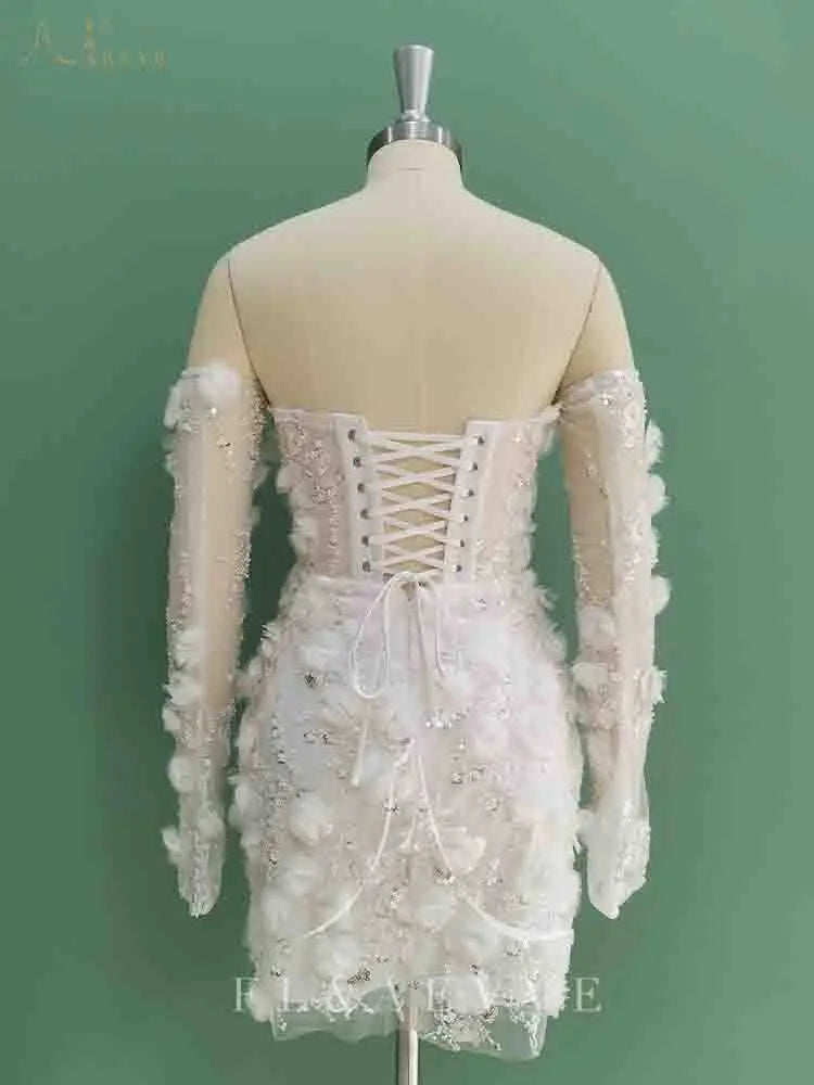 White lace dress on a mannequin against a green background