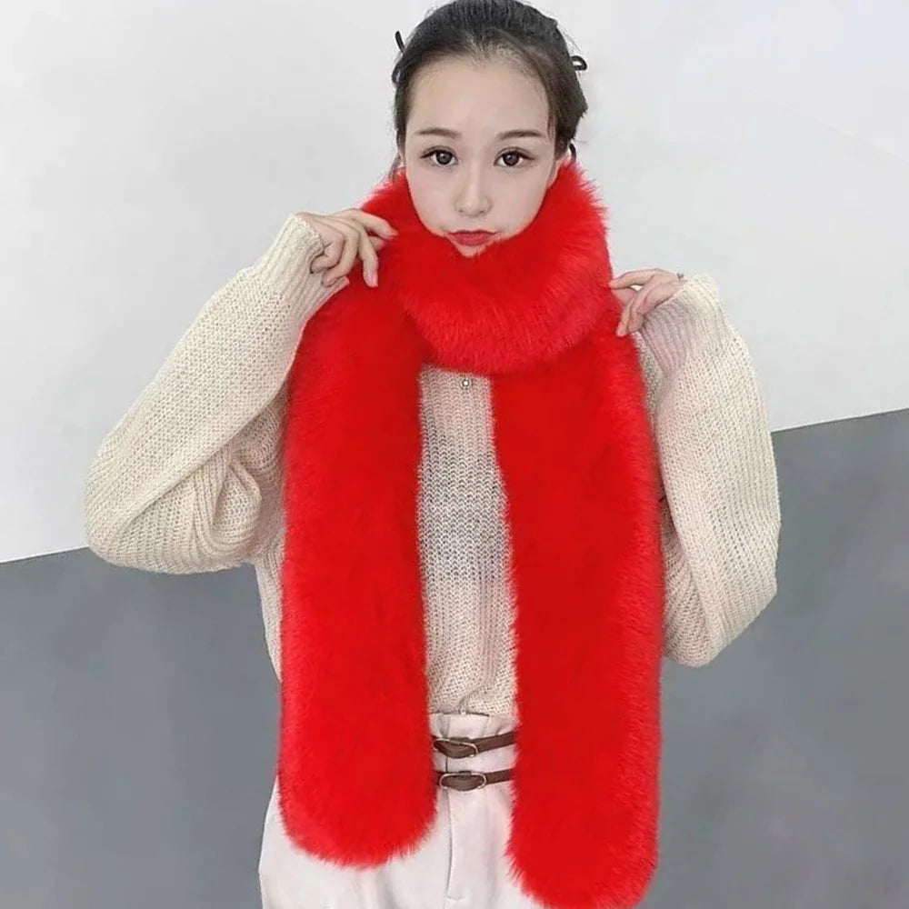 Person wearing a long red fur scarf with a plain background