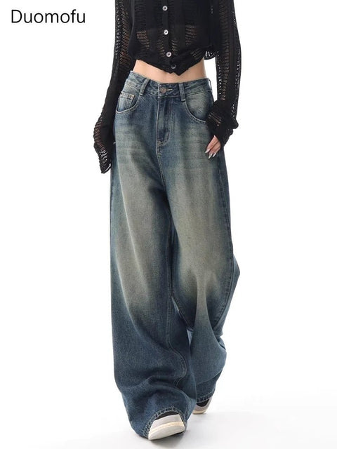 Person wearing wide-leg jeans with a plain background and 'Duomofu' branding.