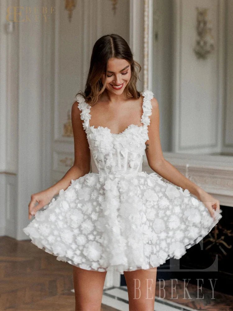 Woman wearing a white floral dress in an elegant interior setting