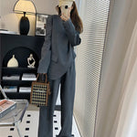 model wearing 2 piece pant suit