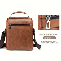 Brown leather crossbody bag with back zip pocket on a white background