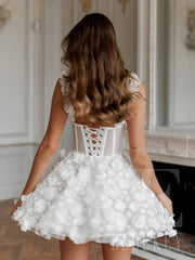 White floral dress worn by a person in an elegant interior setting