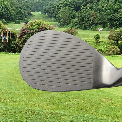 Close-up of a golf club head with a golf course in the background