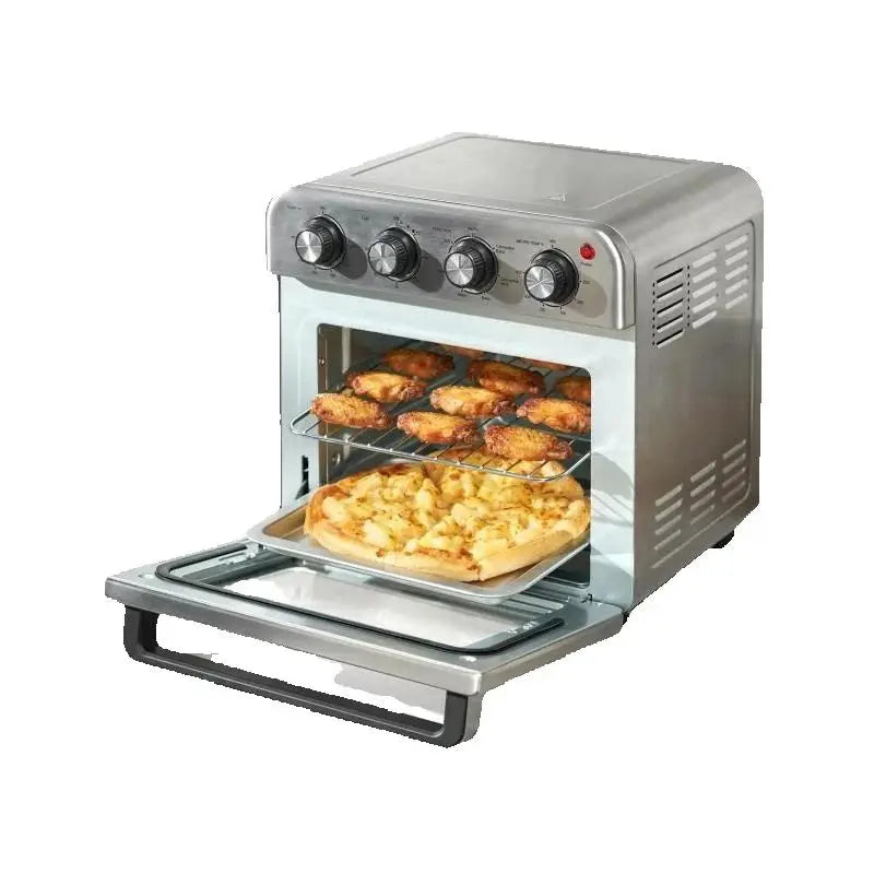 Stainless steel toaster oven with food inside on a white background
