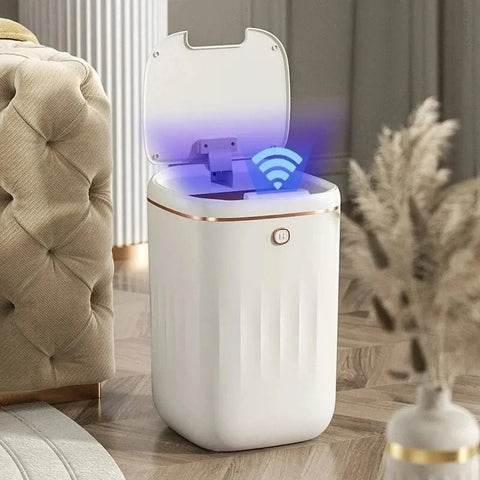 White electronic UV Light Induction Trash Can  with a blue light on a wooden floor in a living room setting.