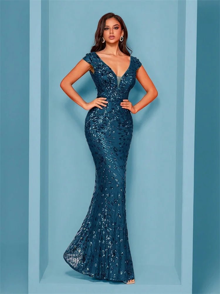 Woman wearing a blue sequin evening gown against a light blue background