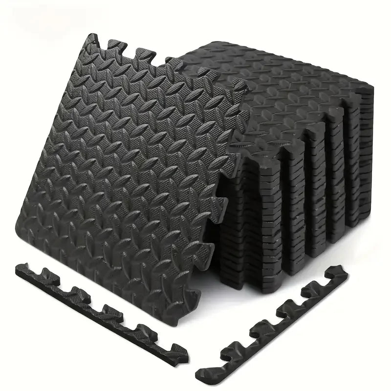 Black foam puzzle mat with interlocking pieces on a white background
