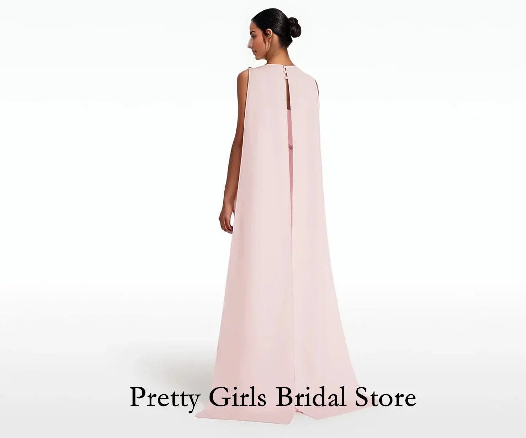 Woman wearing a light pink sleeveless gown on a white background with 'Pretty Girls Bridal Store' text.