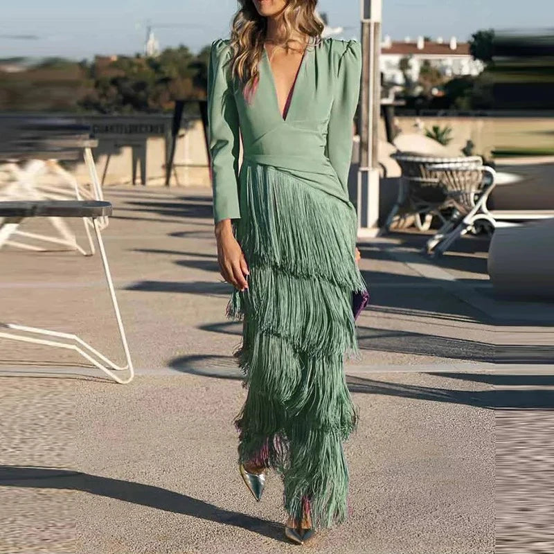 Woman wearing a green dress with a layered skirt in an outdoor setting