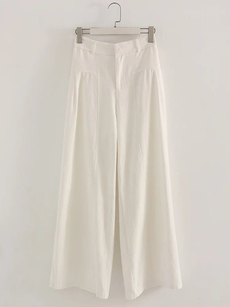 White wide-leg pants on a hanger against a white background