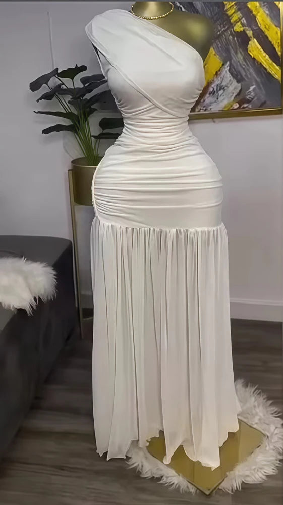 White evening gown on a mannequin against a neutral background