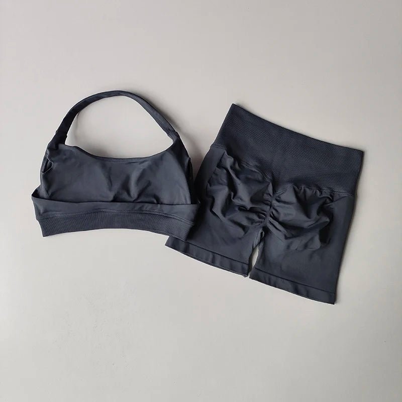 Black bikini set with a bow detail on a light gray background