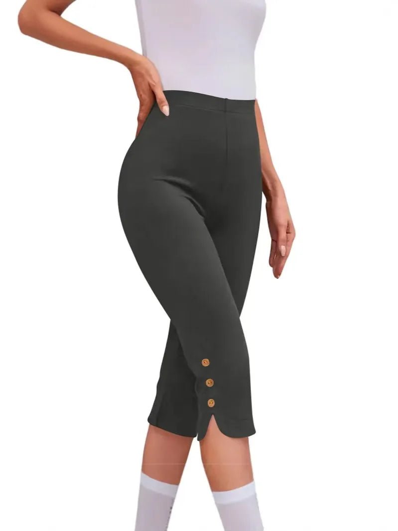 Dark gray capri pants with button details on a white background