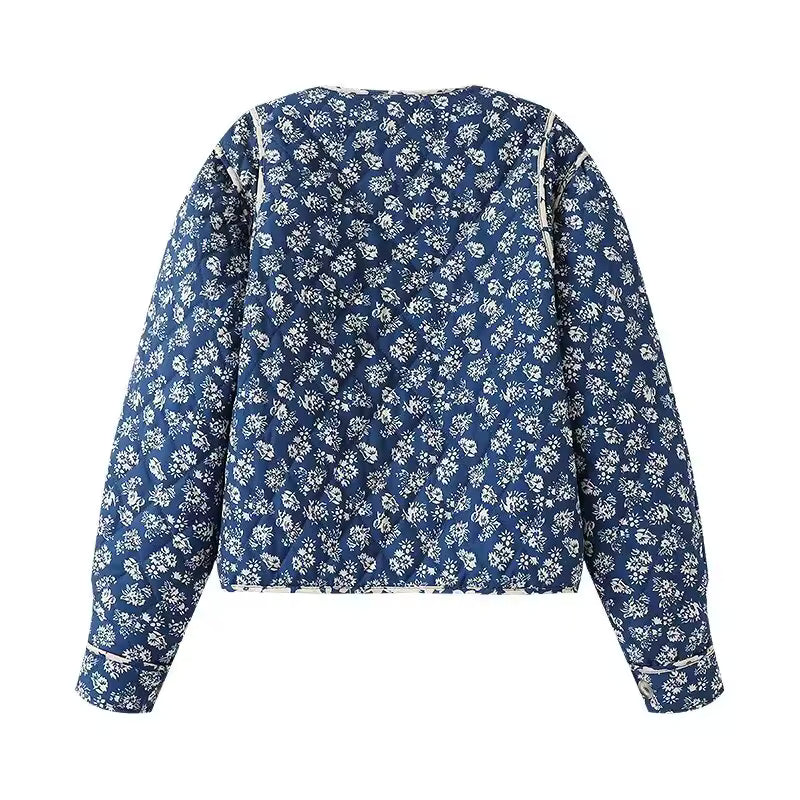 Blue floral blouse with long sleeves on a white background