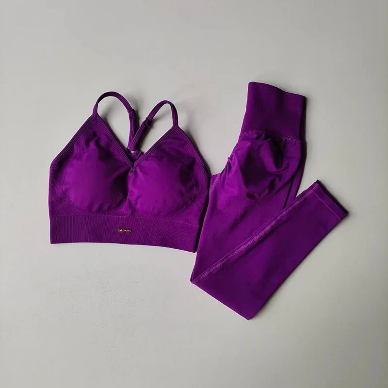 Purple sports bra and leggings set on a gray background