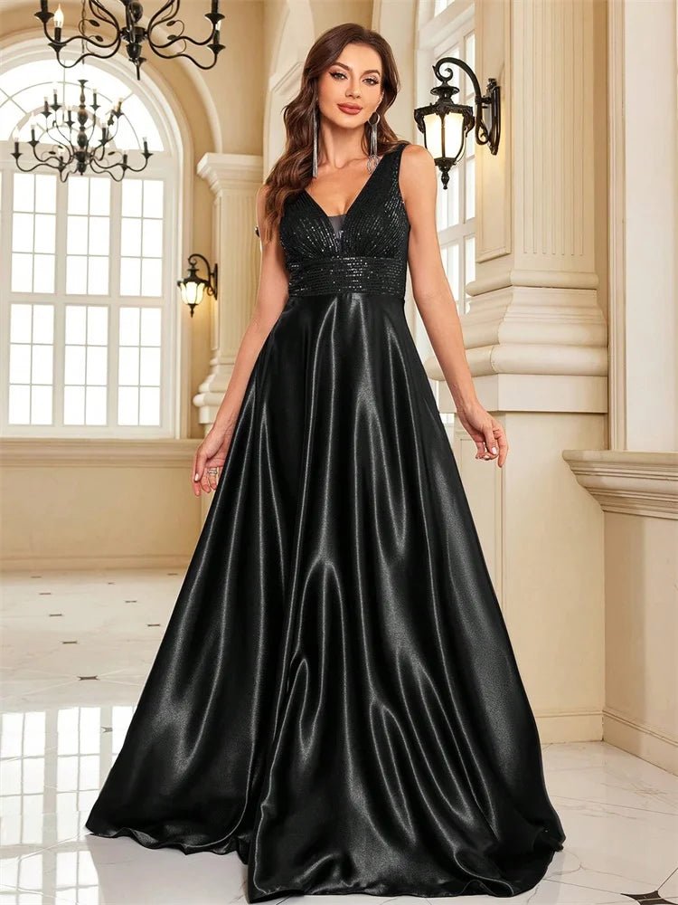 Woman wearing a black evening gown in an elegant indoor setting