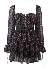 Black floral dress with sheer long sleeves on a white background