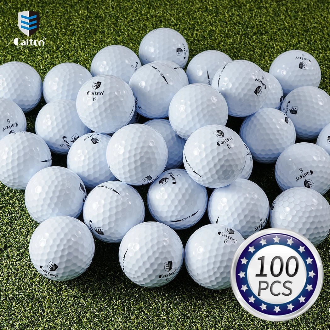 Pile of golf balls with a '100 pcs' badge on grass, featuring the Cailtex brand.