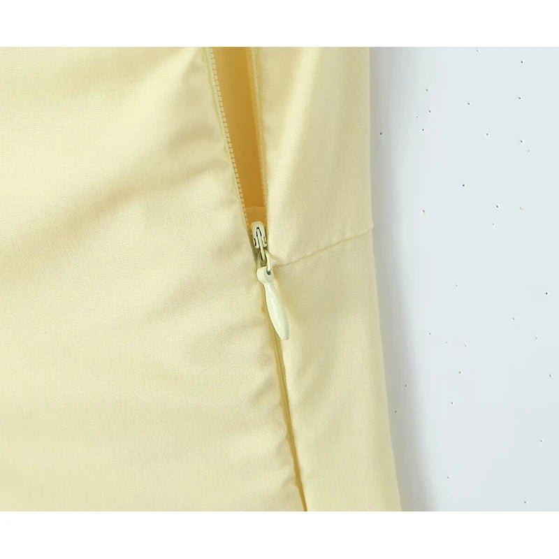 Close-up of a beige fabric with a zipper on a white background
