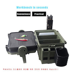 Green fishing tackle box with compartments and fishing lures on a white background