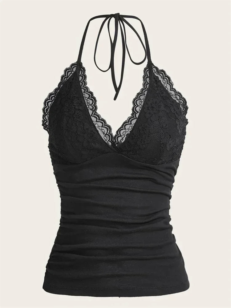 Black lace-trimmed top on a beige background