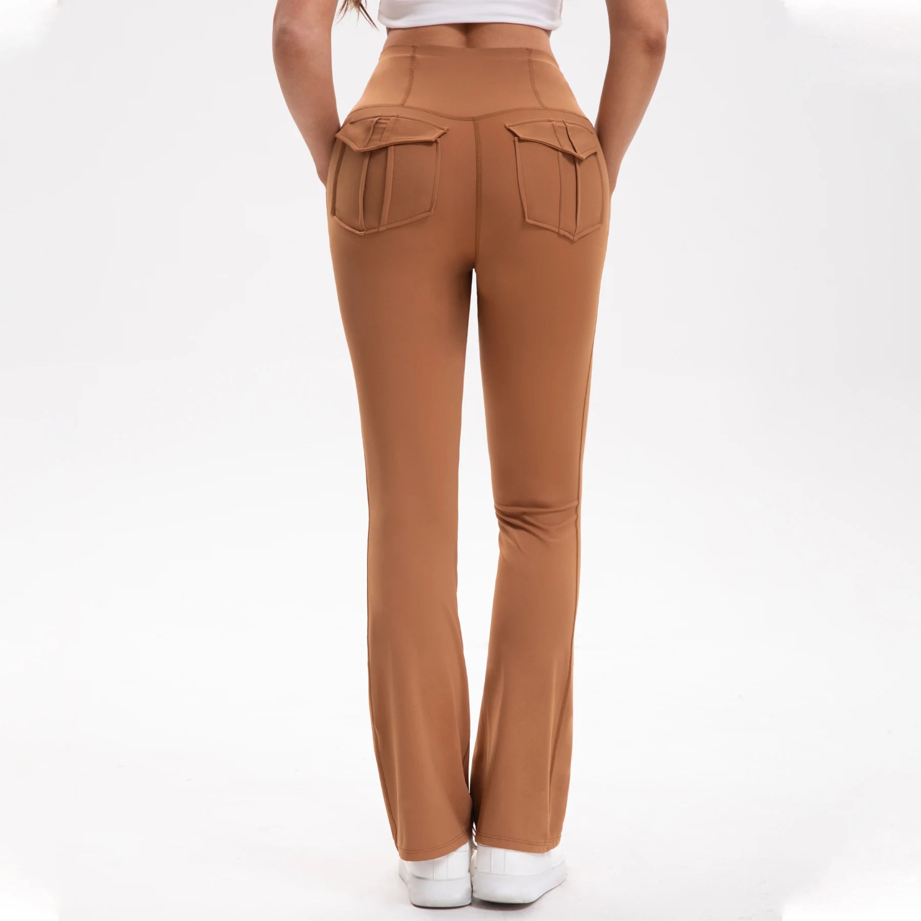 Brown pants worn by a person on a white background