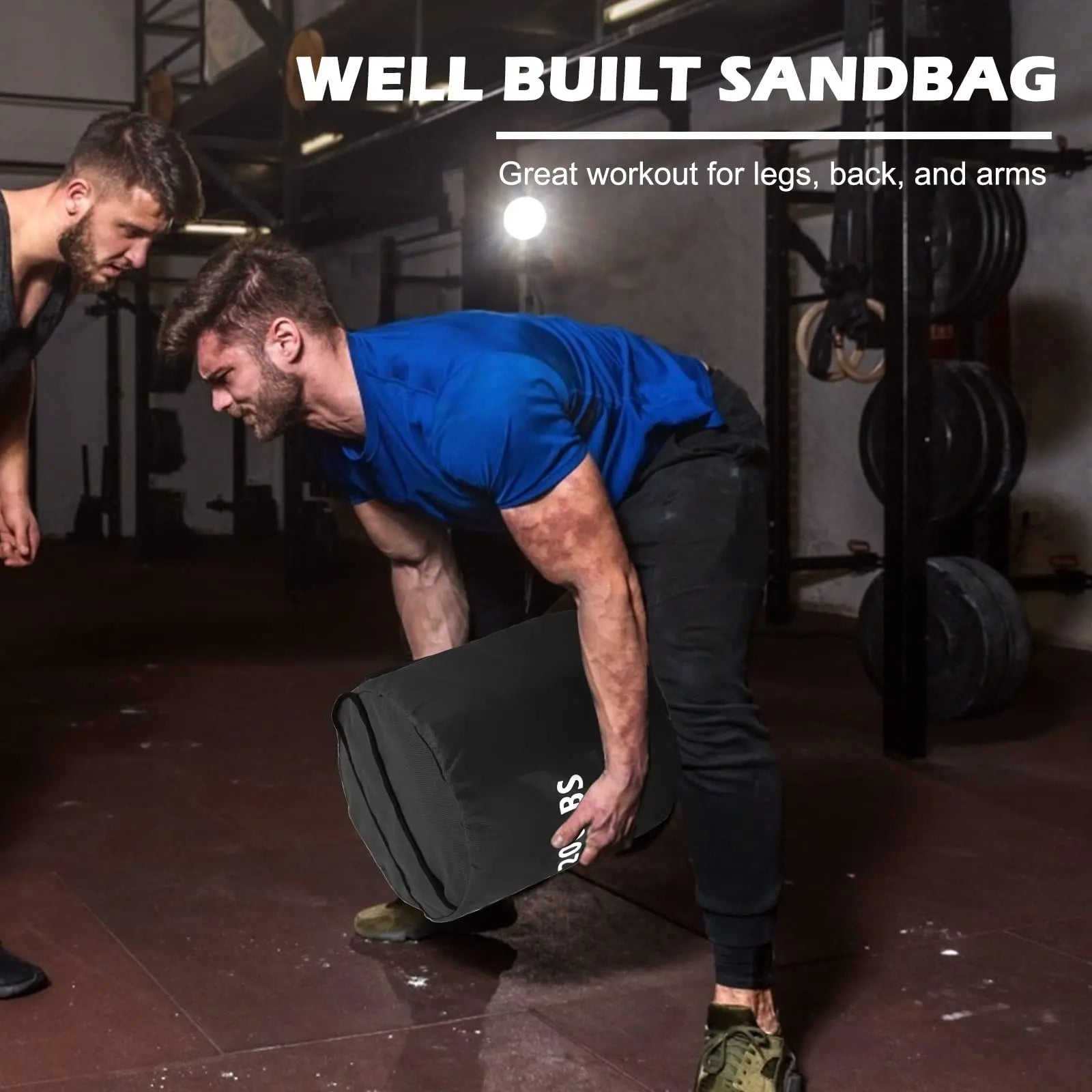 Person using a sandbag for exercise in a gym setting