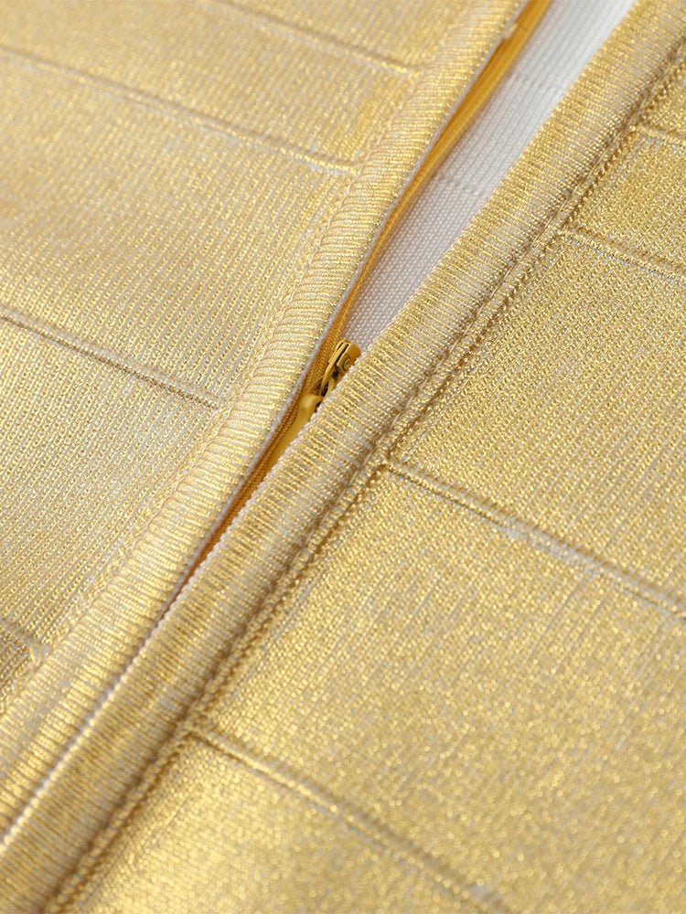 Close-up of a gold textured fabric with a zipper