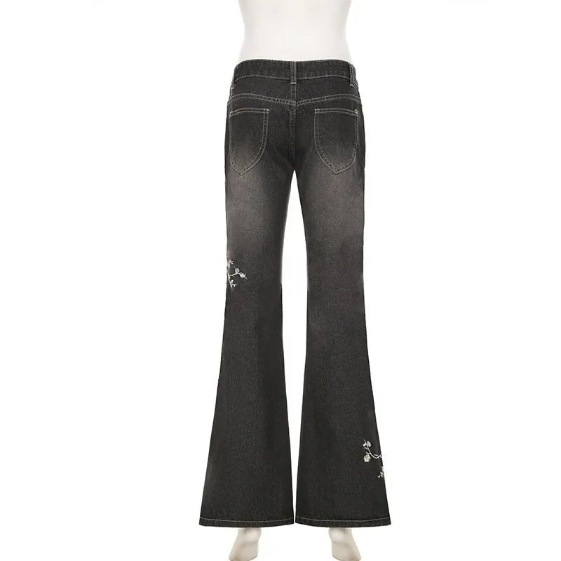 Black flared jeans on a white background