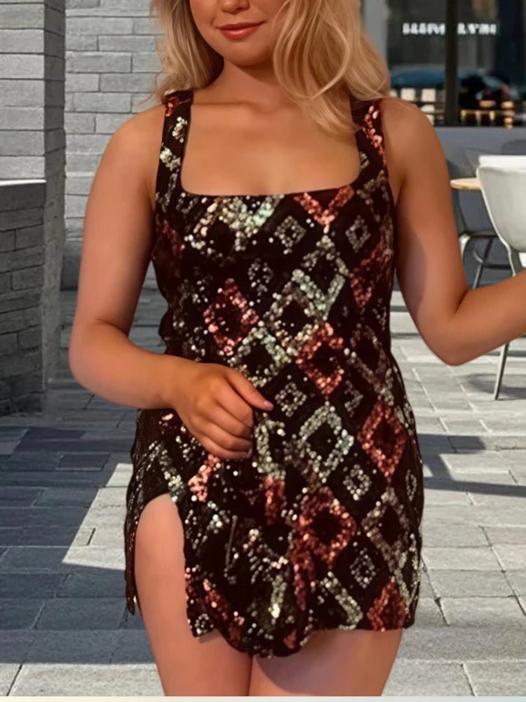 Woman wearing a patterned dress standing outdoors on a tiled pavement.