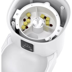 White pet food dispenser with compartments filled with dog treats on a white background