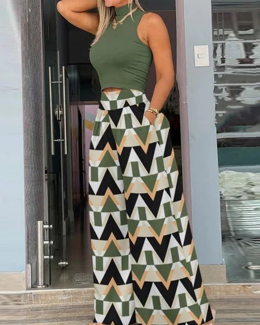 Woman wearing a green top and patterned skirt exiting a building.